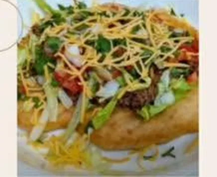The Swìlhcha Indian Taco — kidney bean chili piled on golden frybread with lettuce, cheese and tomato