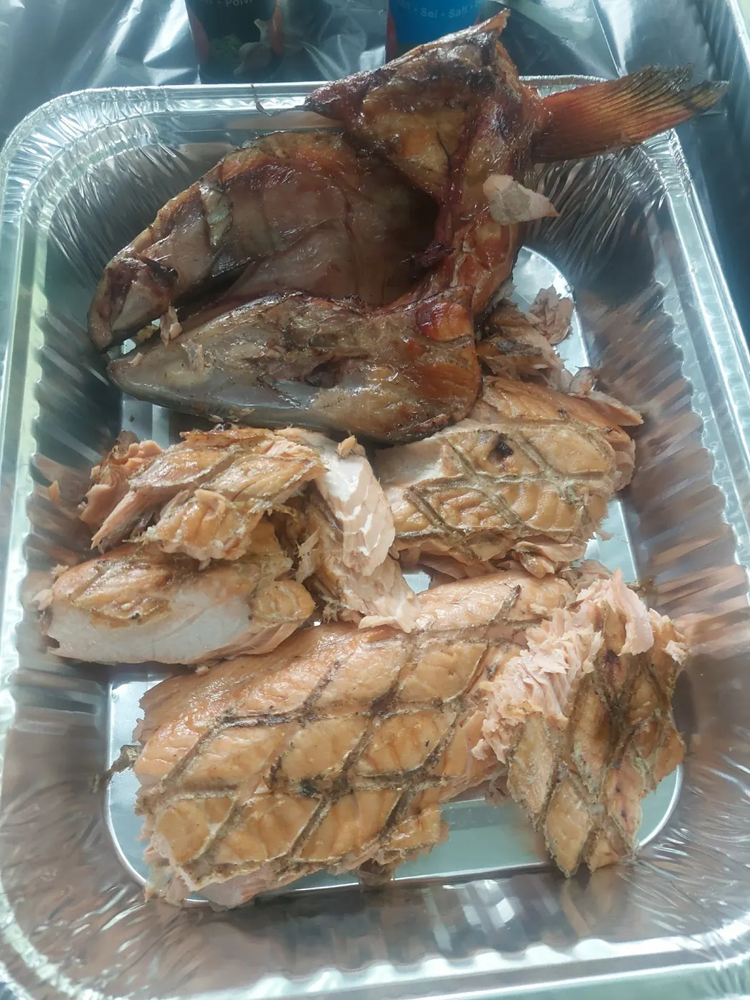 Trays of BBQ wild salmon ready for the buffet line